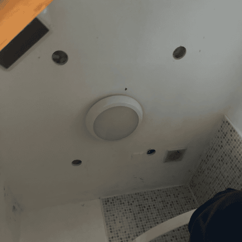 Small bathroom ceiling before rewiring, Dublin